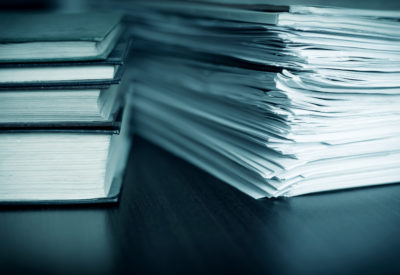 Large pile of magazine and books closeup; welcoming the new MD Accounting website for accounting and taxes
